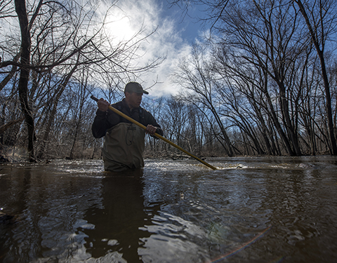 Man in water with a net